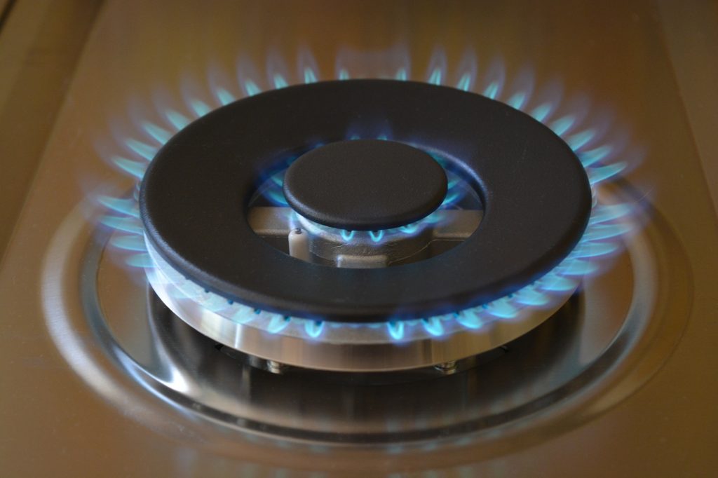Double gas ring on a brand new gas stove, burning with a blue flame